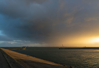 Scenic view of sea against sky during sunset