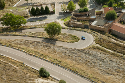 High angle view of road by trees in city