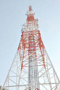Low angle view of communications tower against clear sky