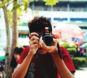 Portrait of man photographing