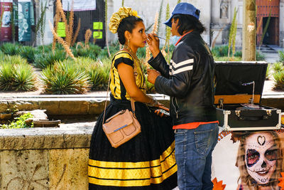 Full length of couple standing outdoors