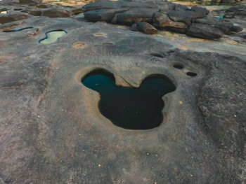 High angle view of hole on rock