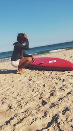 Woman standing on beach