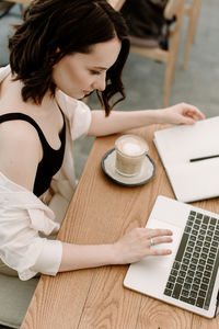 High angle view of woman using smart phone