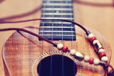 Close-up of guitar on table