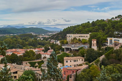 Buildings in town against sky