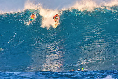 People swimming in sea