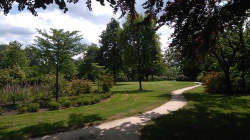 Scenic view of green landscape against sky