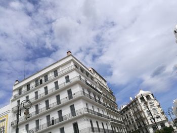 Low angle view of buildings against sky in city