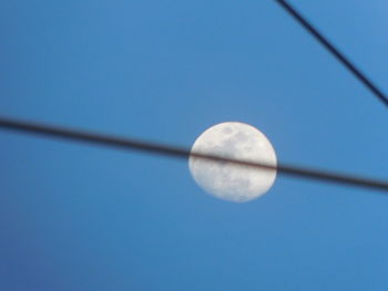 Close-up of moon against clear blue sky