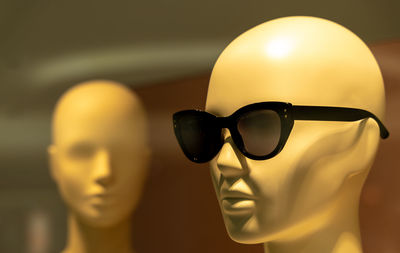 Close-up of sunglasses on mannequin in store