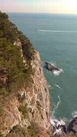 High angle view of sea by cliff