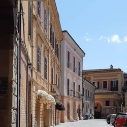 Street amidst buildings against sky