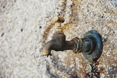 Close-up of water pipe against wall