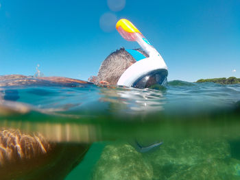 View of man swimming in sea