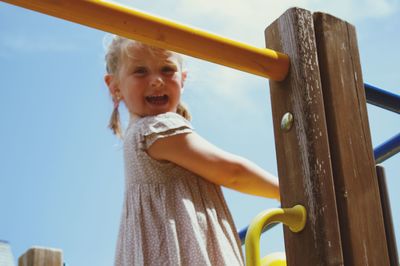 Low angle view of girl on playgound