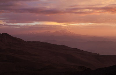 Scenic view of mountains against sky during sunset