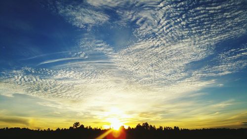 Sun shining through clouds