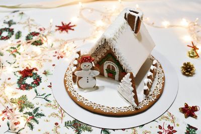 High angle view of gingerbread house on table