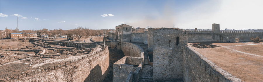 Panoramic view of old ruins against sky