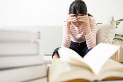 Low section of woman sitting on floor