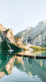 Scenic view of lake and mountains against clear sky