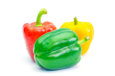 Close-up of bell peppers against white background