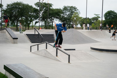 Man skateboarding on skateboard in city