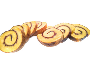 Close-up of bread against white background