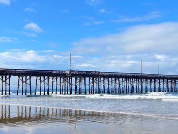 Pier over sea against sky