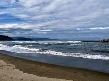 Scenic view of beach against sky