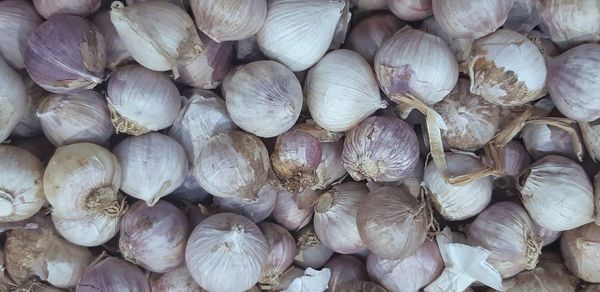 Full frame shot of onions for sale at market