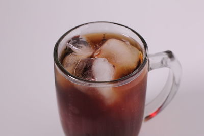 Close-up of coffee cup against white background