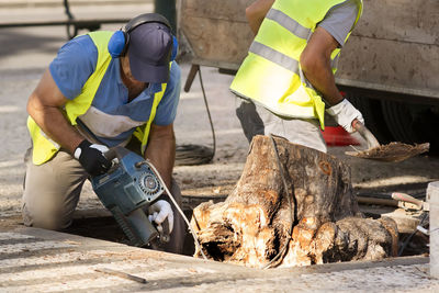 Man working on barbecue grill