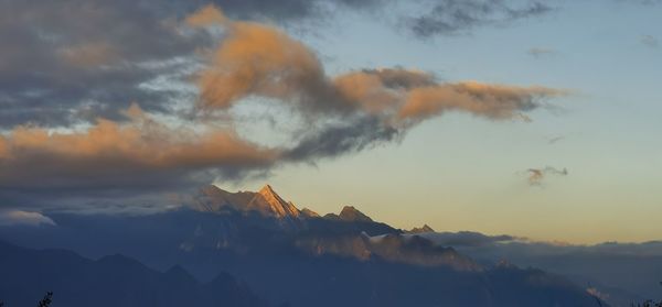 Scenic view of mountains against sky during sunset