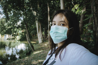 Portrait of woman in a park