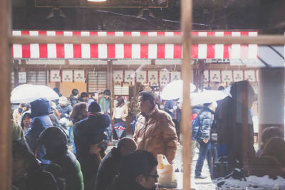 Group of people walking in market