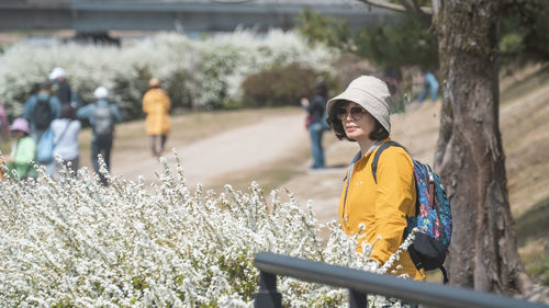 Rear view of woman working on field