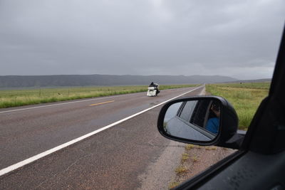 Road seen through car windshield