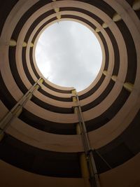 Low angle view of spiral building against sky