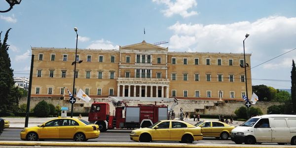 View of buildings against cloudy sky