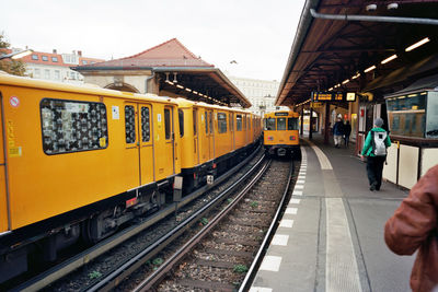 Train at railroad station against sky