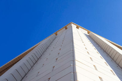 Low angle view of building against blue sky