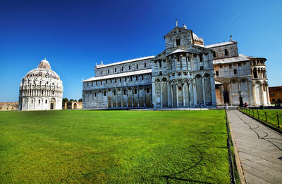 Exterior of historic buildings against clear blue sky