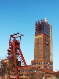 Low angle view of skyscraper against clear sky