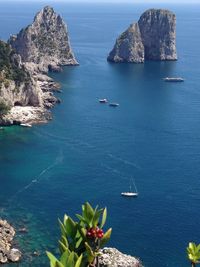 Scenic view of sea with rocks in background