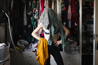 Rear view of woman standing in store