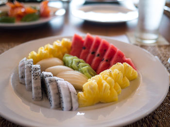 Close-up of fruits in plate on table