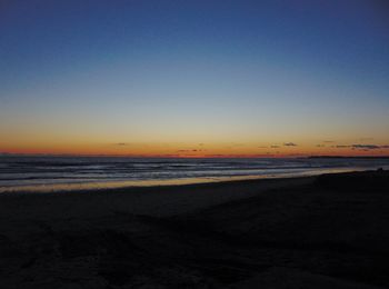 View of beach at sunset