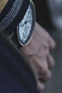 Close-up of man wearing watch